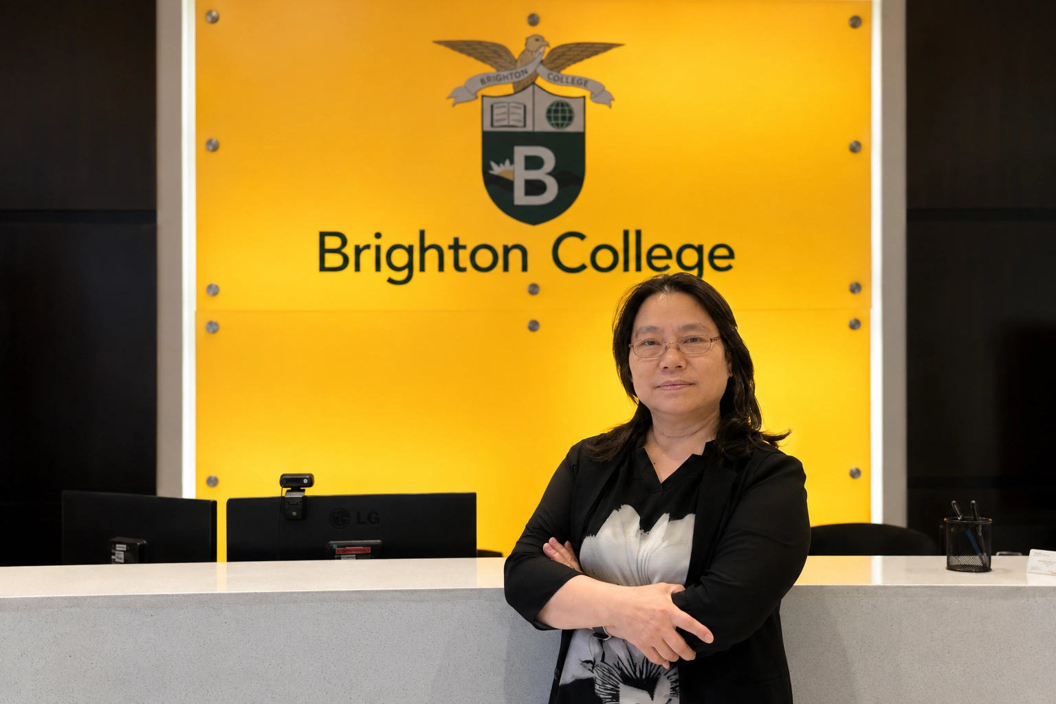 Polly Zheng at the Brighton College reception desk